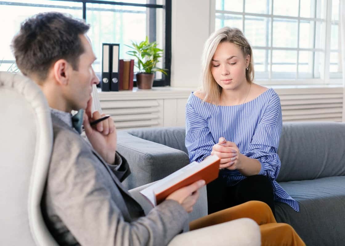 Therapist with young female patient