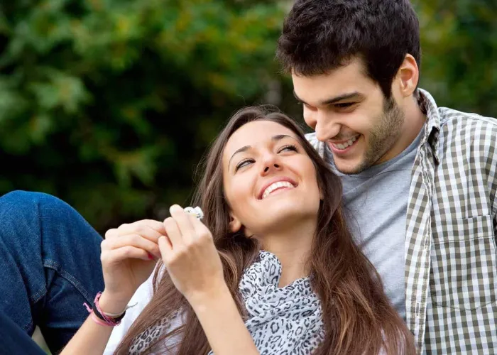 Close up portrait of attractive young  couple in love outdoors.