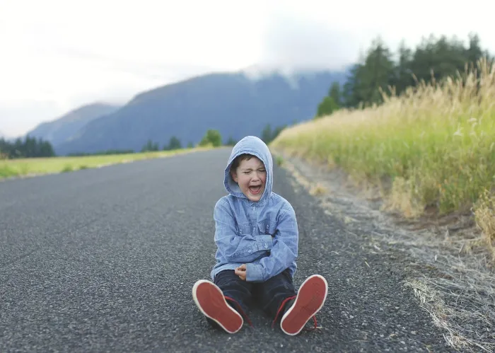 young boy having a tantrum and a meltdown.