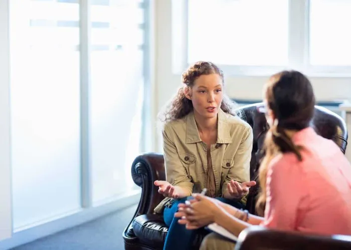 Psychologist having session with her patient in office