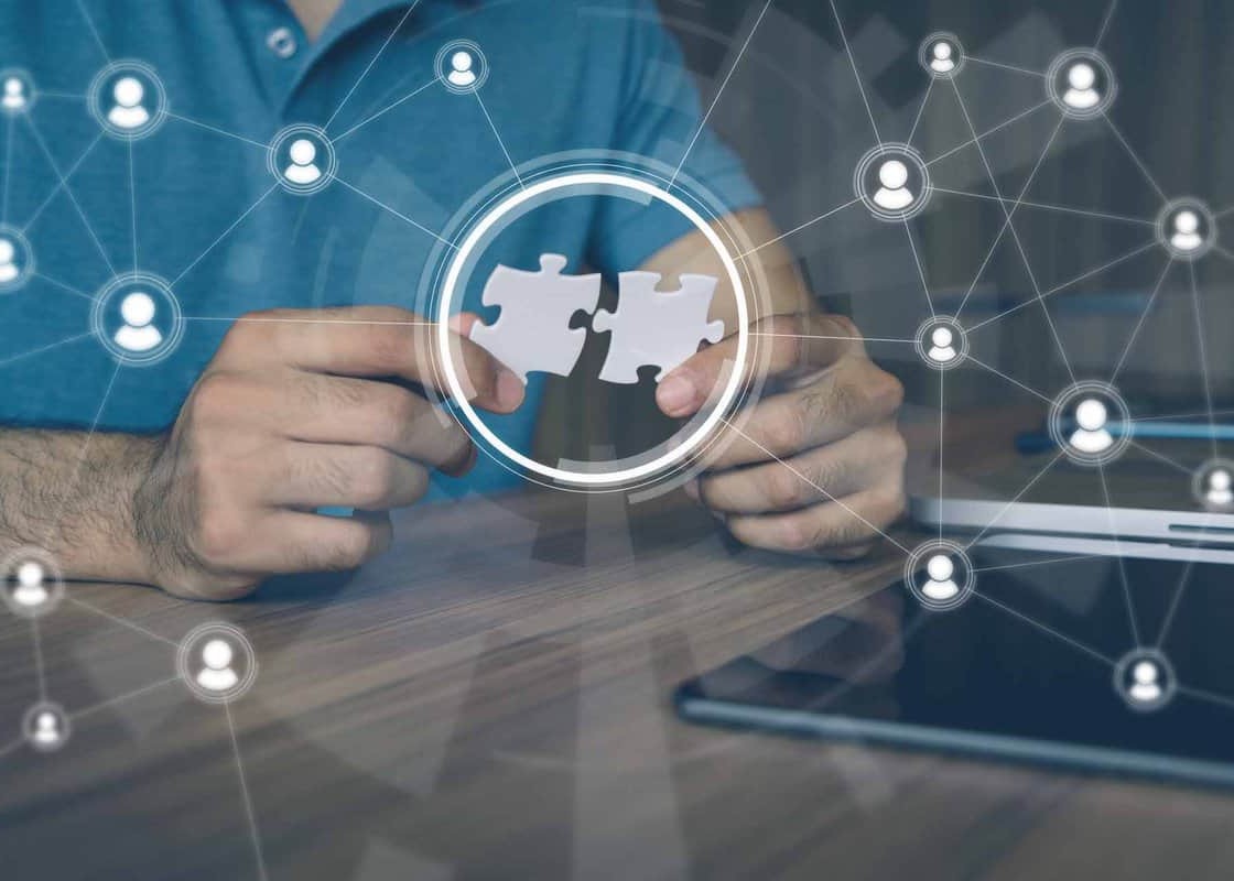 man holding pieces of jigsaw puzzle. business matching concept. crowd sourcing. freelancer. teleworking.